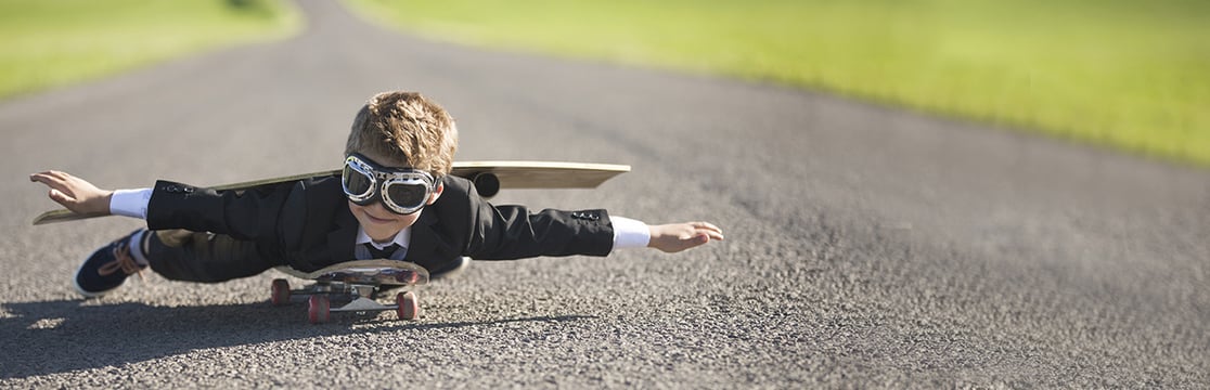 Child laying down on skateboard Child laying down on skateboard